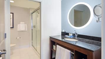 Shower, designer toiletries, hair dryer, towels