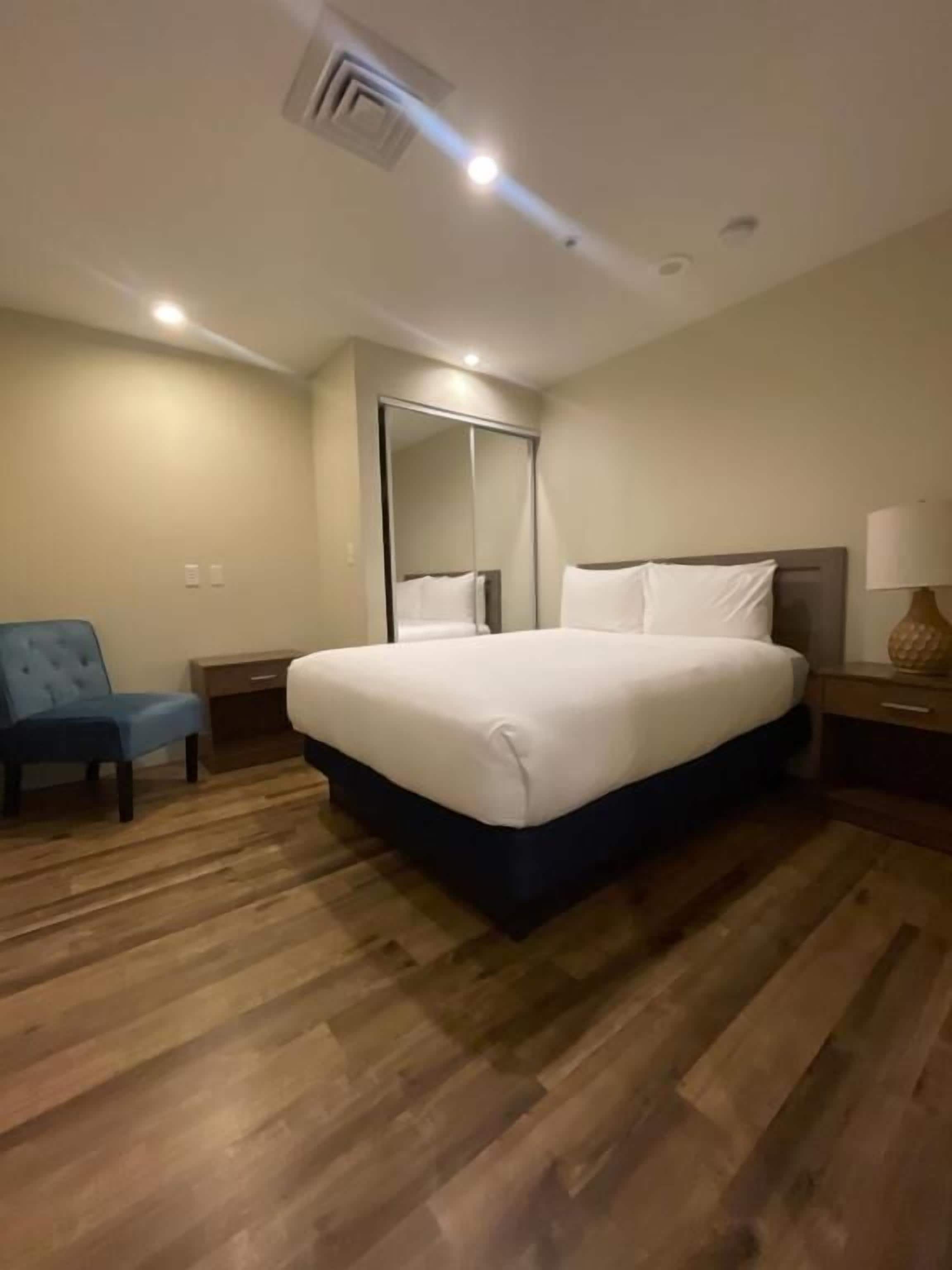 suite, 2 bedrooms (1 king bed and 1 full bed) | premium bedding, in-room safe, desk, blackout curtains