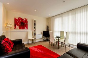 Flat-screen TV, DVD player, iPod dock