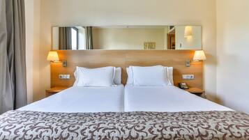 Luxe beddengoed, een gratis minibar, een kluis op de kamer, een bureau