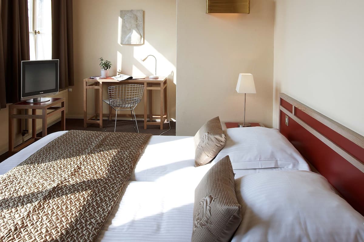 standard double or twin room | in-room safe, desk, laptop workspace, blackout curtains