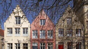 Three historic buildings with distinct architectural styles, including a building labeled "HOTEL DORNE." - Hotel Adornes (Bruges)