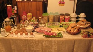 A breakfast buffet with various food items and condiments. - Diamant- Guest House (Karlovy Vary)