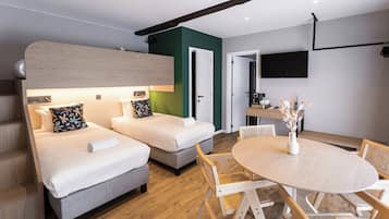 Executive Suite | Minibar, in-room safe, individually decorated, individually furnished