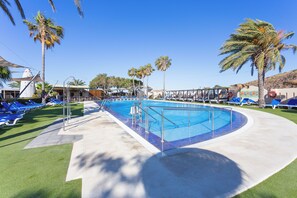 Seasonal outdoor pool, pool loungers