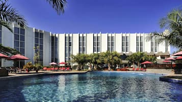 Outdoor pool, pool umbrellas, sun loungers