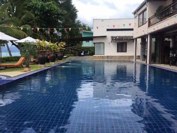 2 outdoor pools, pool umbrellas, pool loungers