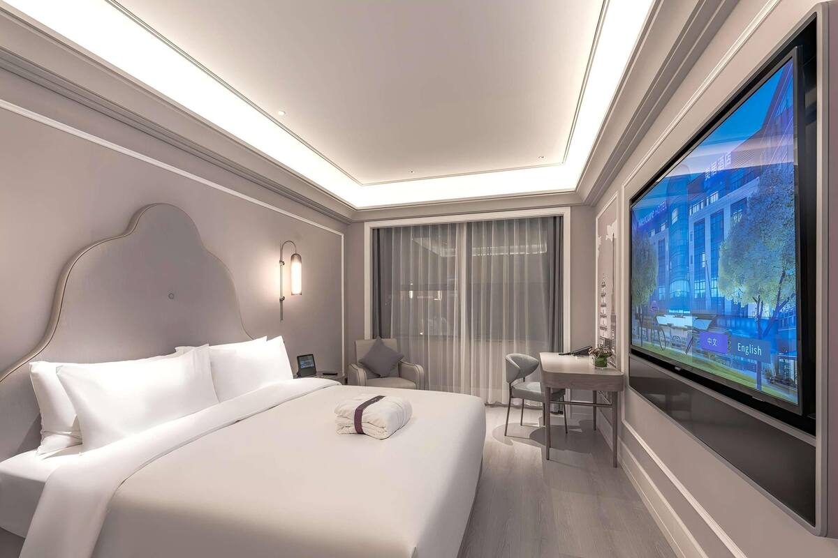 Chambre Deluxe, 1 trĂšs grand lit