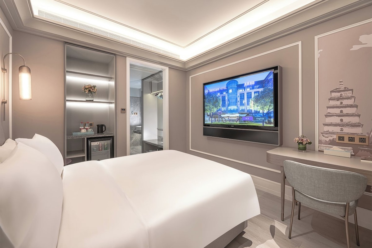 Premium bedding, down comforters, memory foam beds, minibar