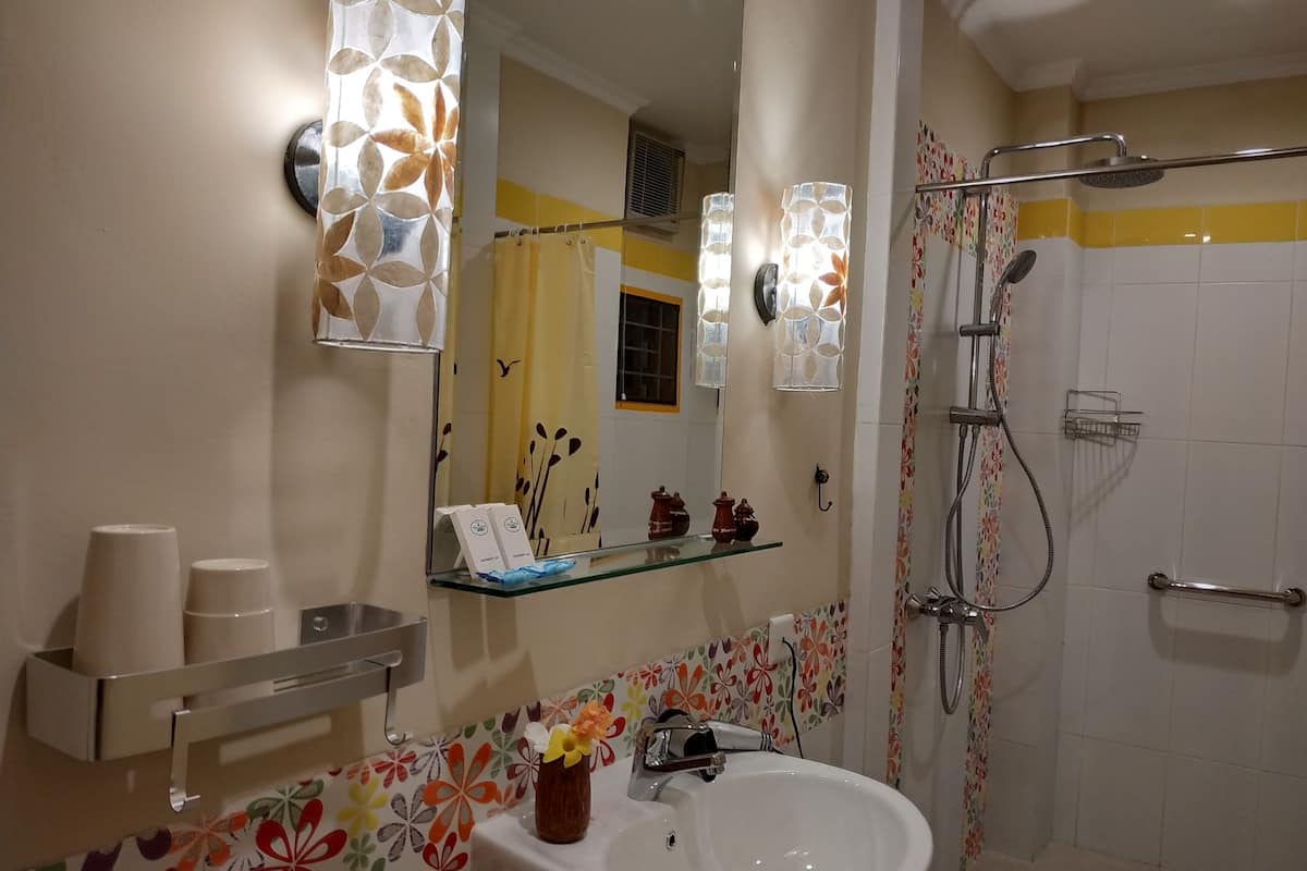 family room, 1 bedroom, garden view | bathroom | shower, rainfall showerhead, free toiletries, hair dryer