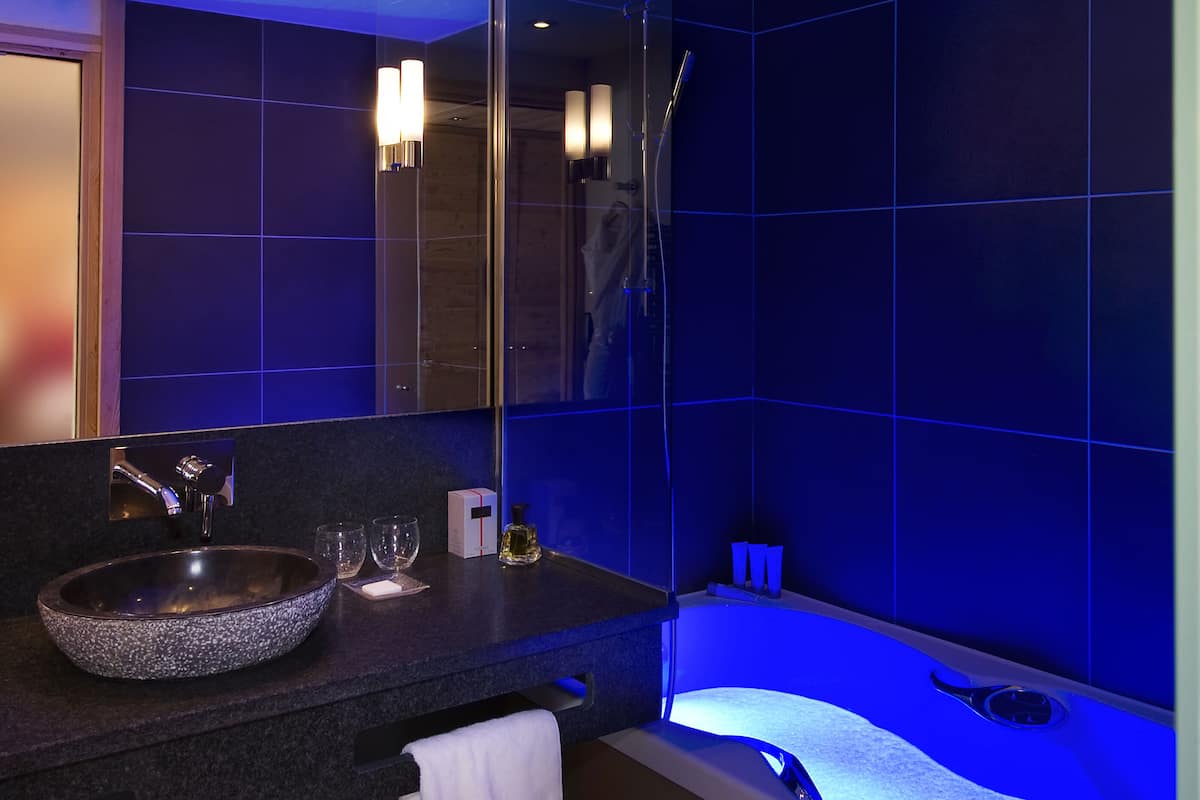 hair dryer, bathrobes, slippers, towels