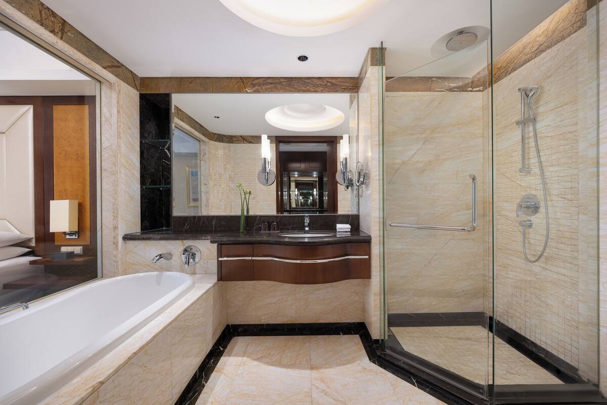 separate bathtub and shower, designer toiletries, hair dryer, bathrobes