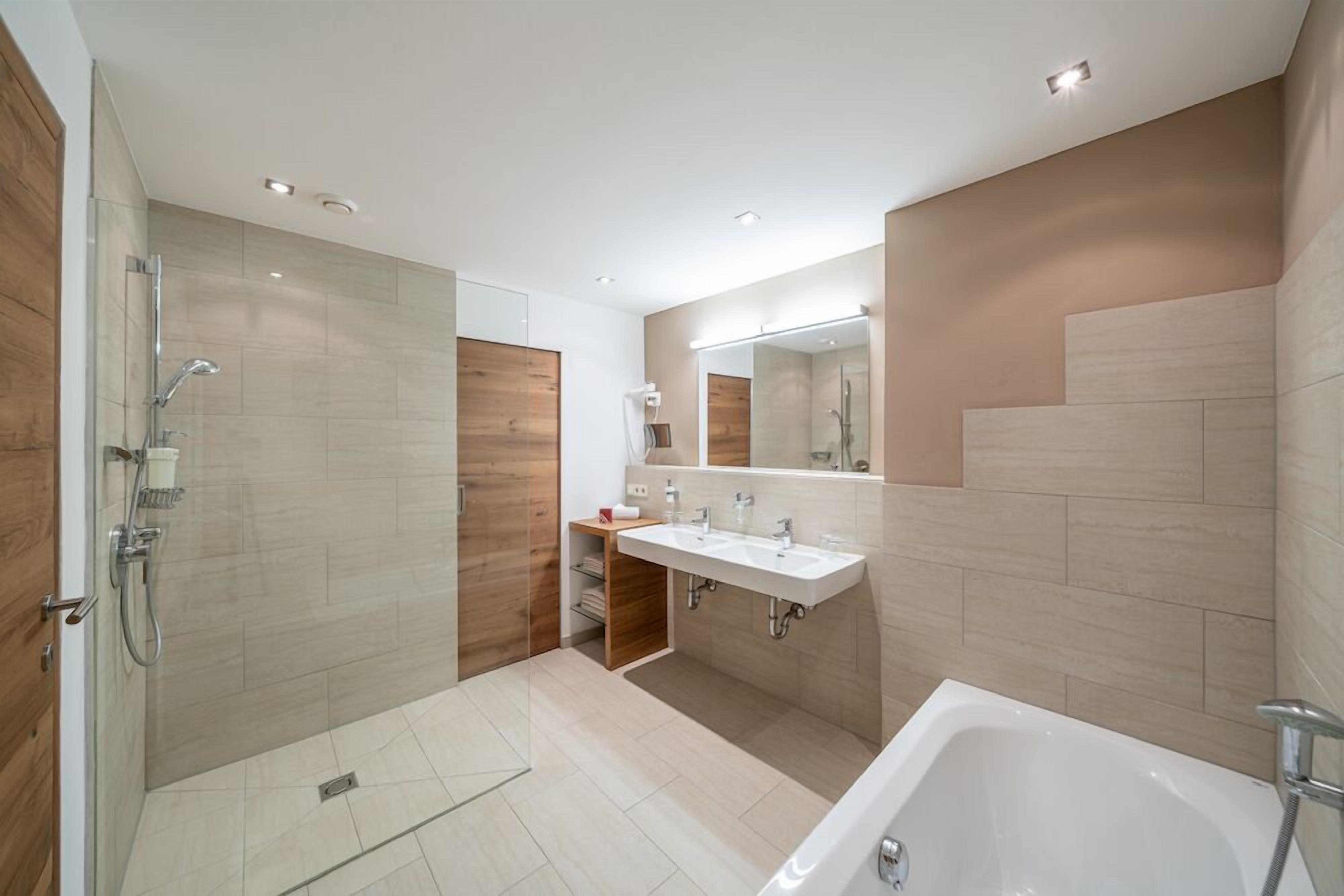 superior double room, balcony | bathroom | deep-soaking bathtub, hair dryer, bathrobes, slippers