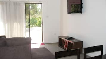 Deluxe Apartment, 2 Bedrooms | Living area | TV, first-run movies