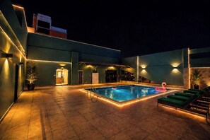 Outdoor pool, open 7:00 AM to 10:00 PM, pool umbrellas - Al Manzil Hotel Bahrain (Manama)