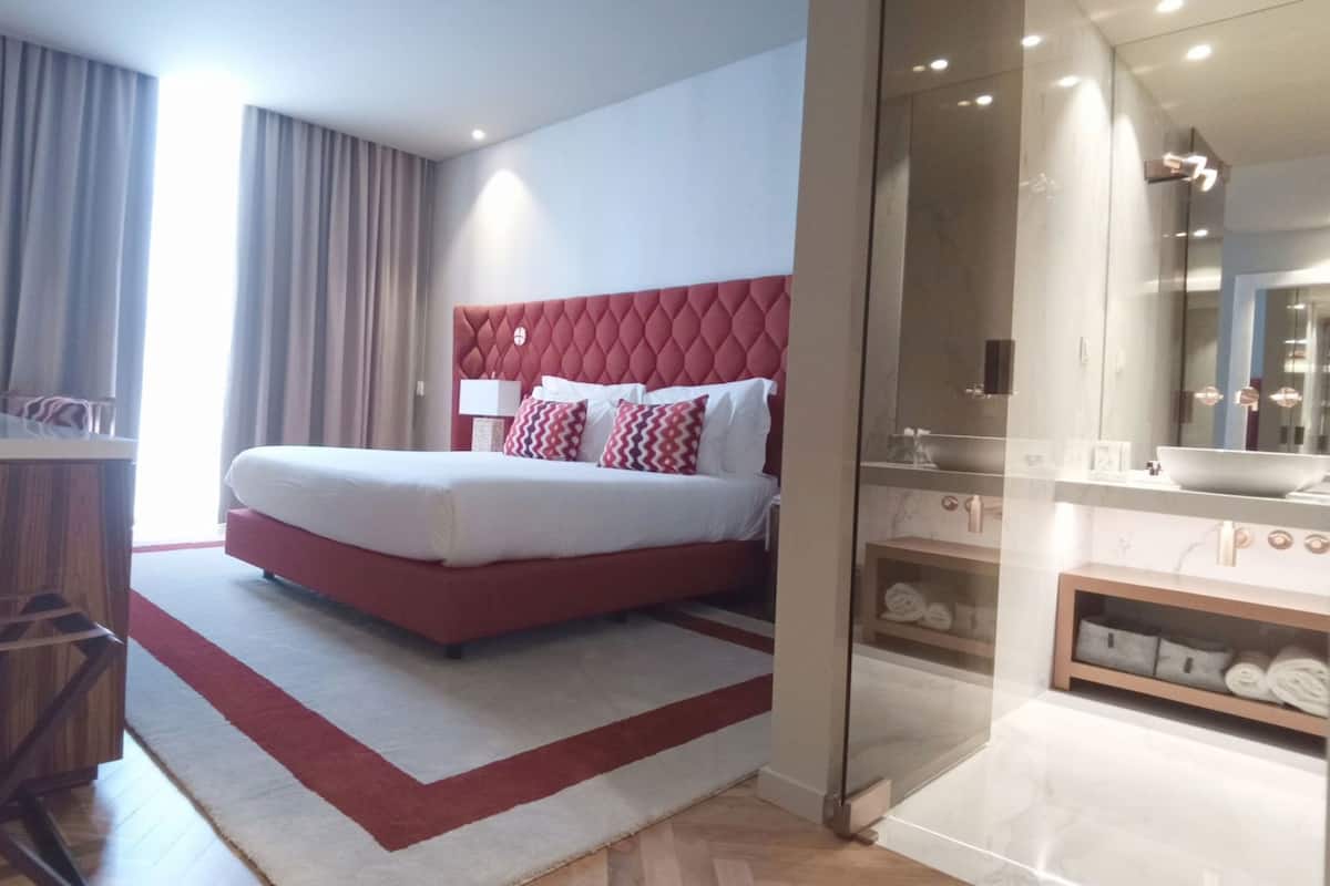 Premium bedding, memory-foam beds, minibar, in-room safe