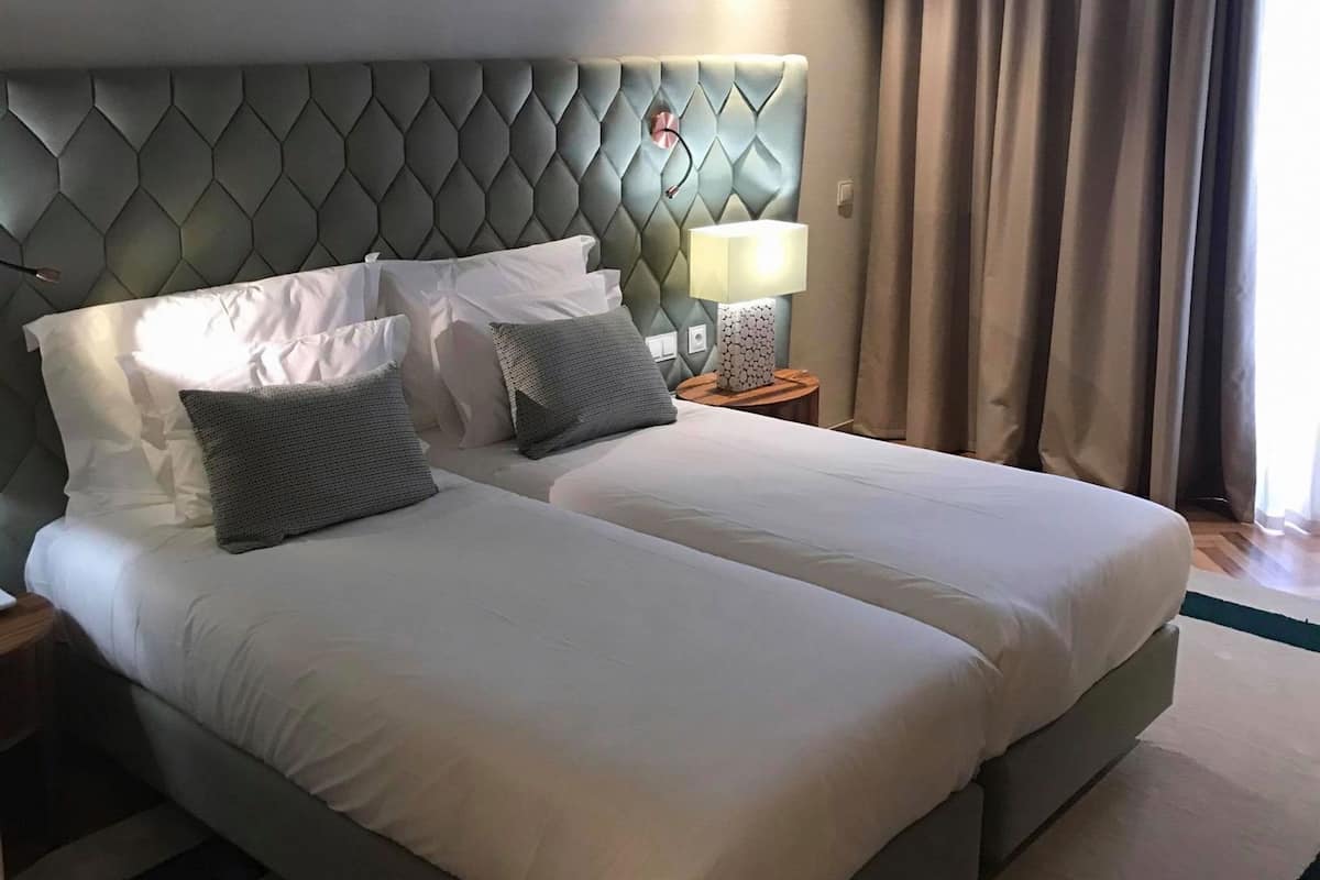 Premium bedding, memory foam beds, minibar, in-room safe