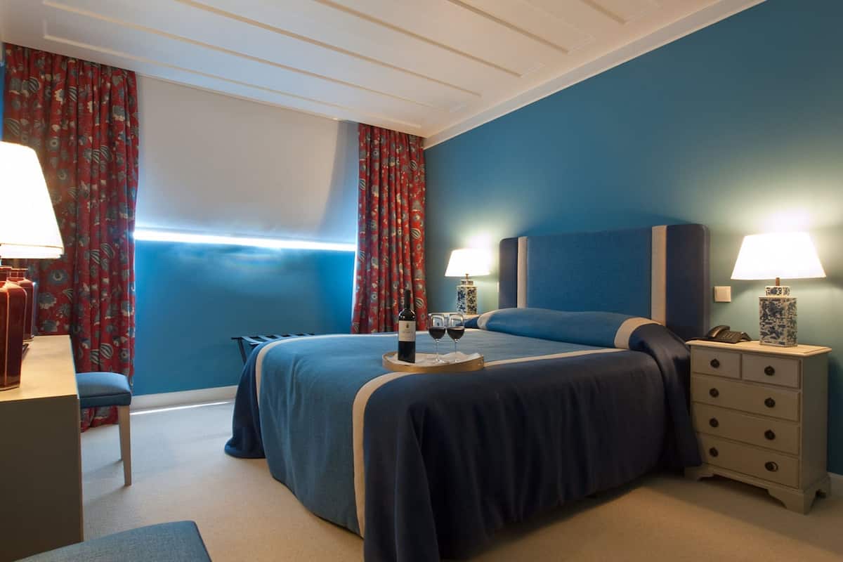 Premium bedding, memory-foam beds, minibar, in-room safe