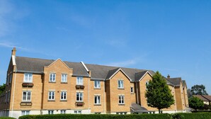 A multi-story residential building with a brick facade, multiple windows, and a symmetrical design. - Your Stay Bristol Orchard Gate (Bristol)