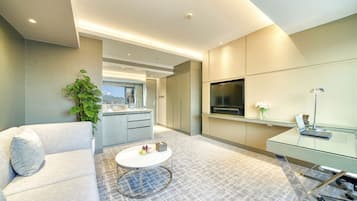 Executive Suite | Living room | 37-inch flat-screen TV with digital channels, TV, pay movies