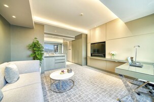 Executive Suite | Living room | 37-inch flat-screen TV with digital channels, TV, pay films