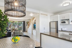 Two Bedroom Premium Balcony Apartment | Private kitchen | Full-size fridge, microwave, oven, stovetop