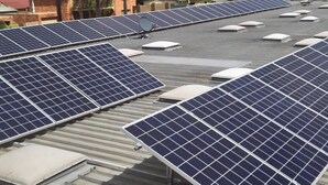 Solar panels on a rooftop with a clear sky and some clouds. - Albury Burvale Motor Inn (Albury)