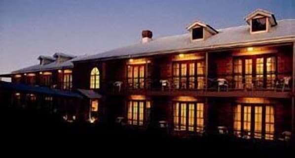 A large, multi-story building with multiple windows and balconies, likely a hotel or resort. - The Manor (Tamborine Mountain)