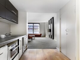 Apartment, 1 Bedroom | Minibar, soundproofing, iron/ironing board, WiFi
