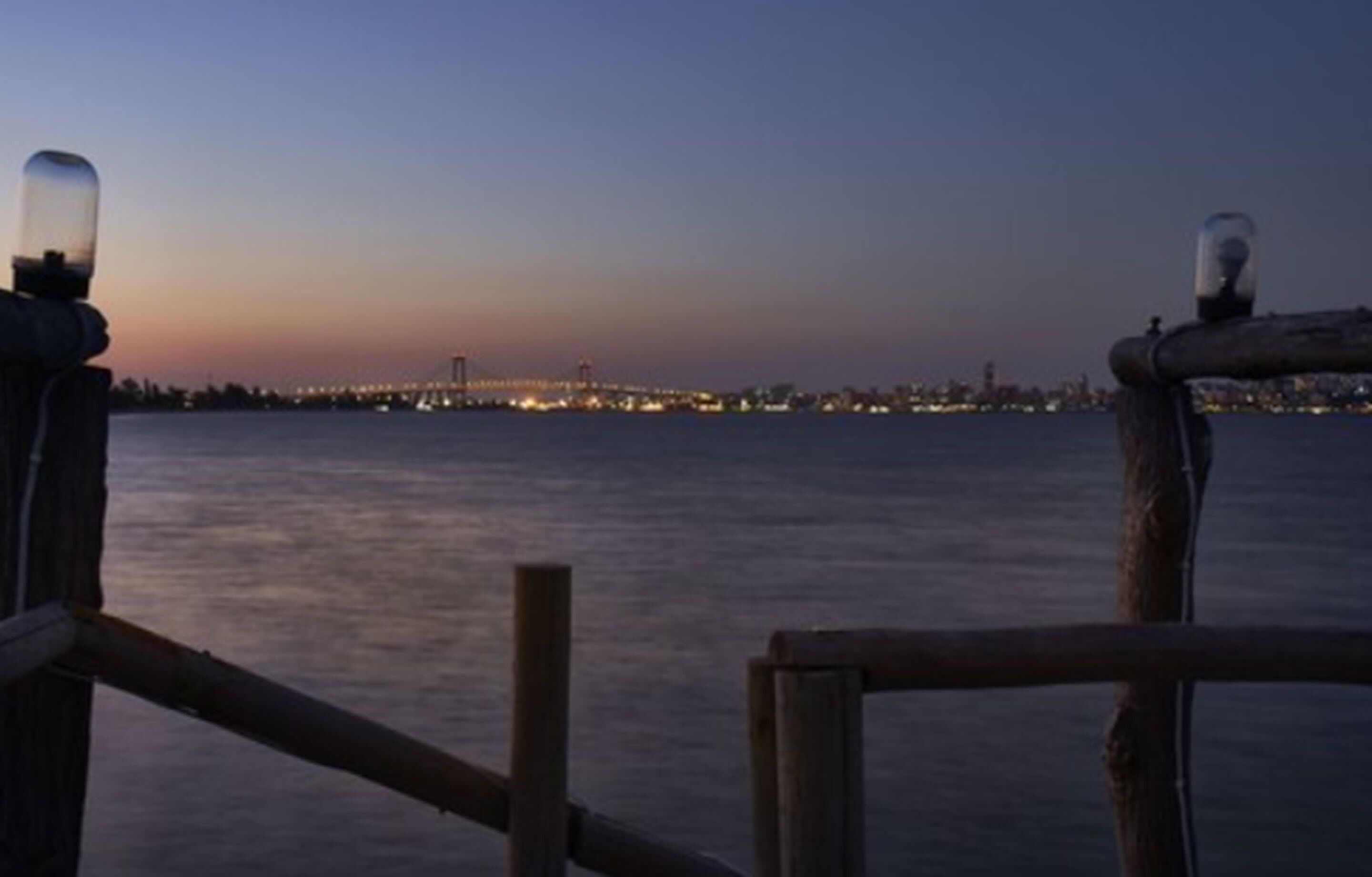 A waterfront view with a city skyline in the background.