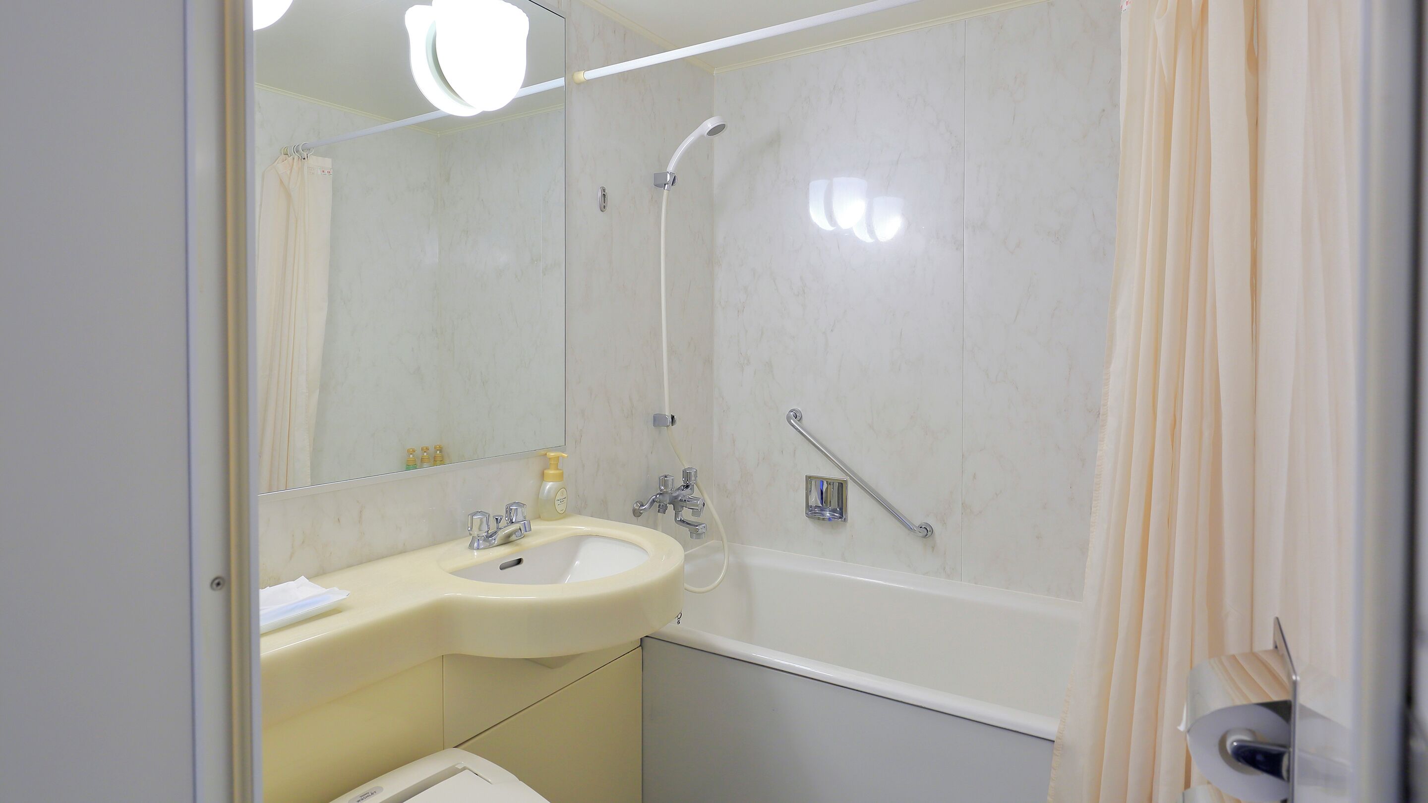 hair dryer, slippers, electronic bidet, towels