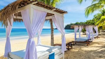 Private beach, white sand, sun loungers, beach towels