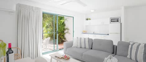 1 Bedroom Deluxe Apartment - Downstairs | Living area | LED TV