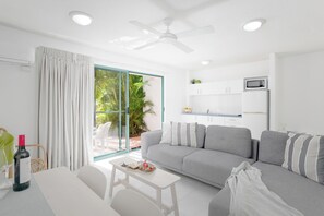 1 Bedroom Deluxe Apartment - Downstairs | Living area | LED TV