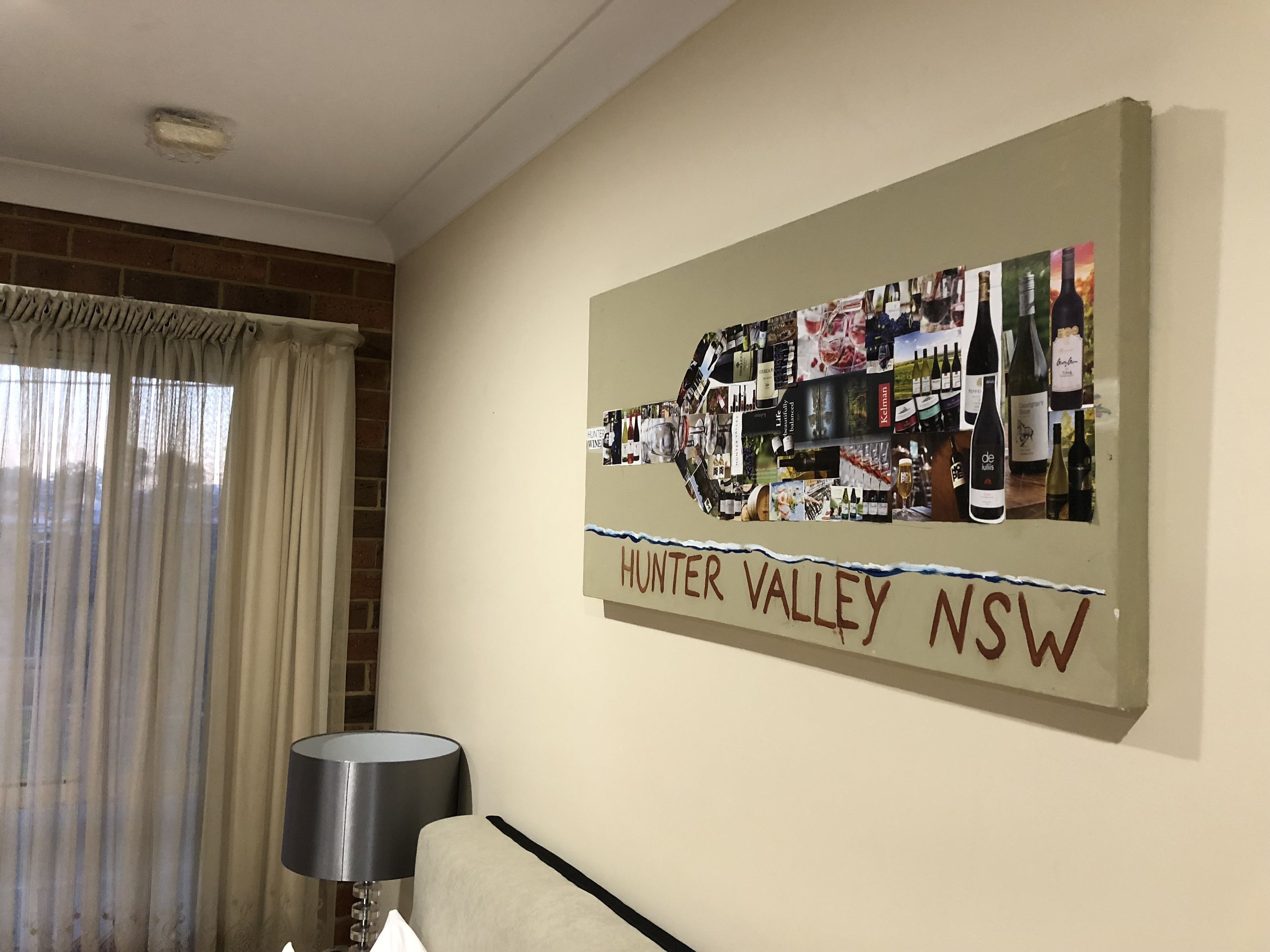 A wall with a Hunter Valley NSW wine-themed artwork.