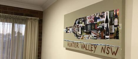A wall with a Hunter Valley NSW wine-themed artwork.