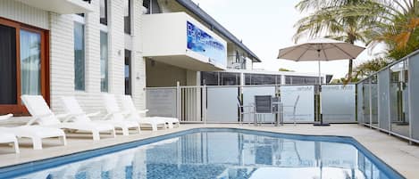 Outdoor pool, pool umbrellas, sun loungers