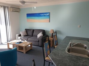 Standard Apartment, 1 Bedroom, Kitchen | Living area | TV