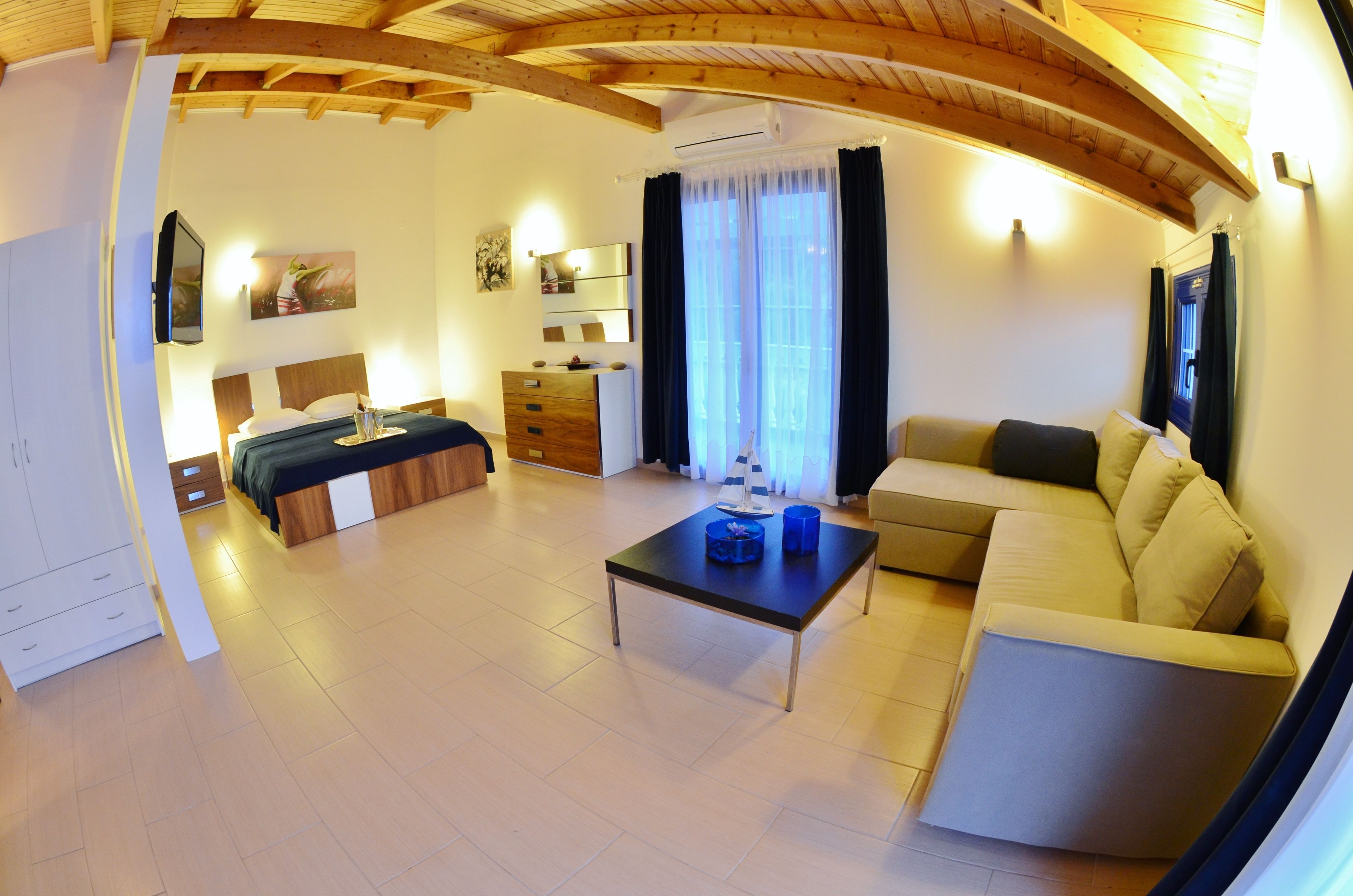 luxury suite, 2 bedrooms, sea view (with kitchen) | living area | tv