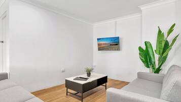 Deluxe Apartment | Living area | 32-inch Smart TV with digital channels, TV