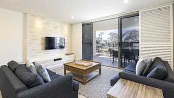 Apartment Ten (2 Bedrooms) | Living area | Flat-screen TV, DVD player, iPod dock
