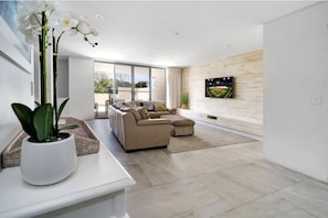 Apartment Three (2 Bedrooms) | Living area | Flat-screen TV, DVD player, iPod dock