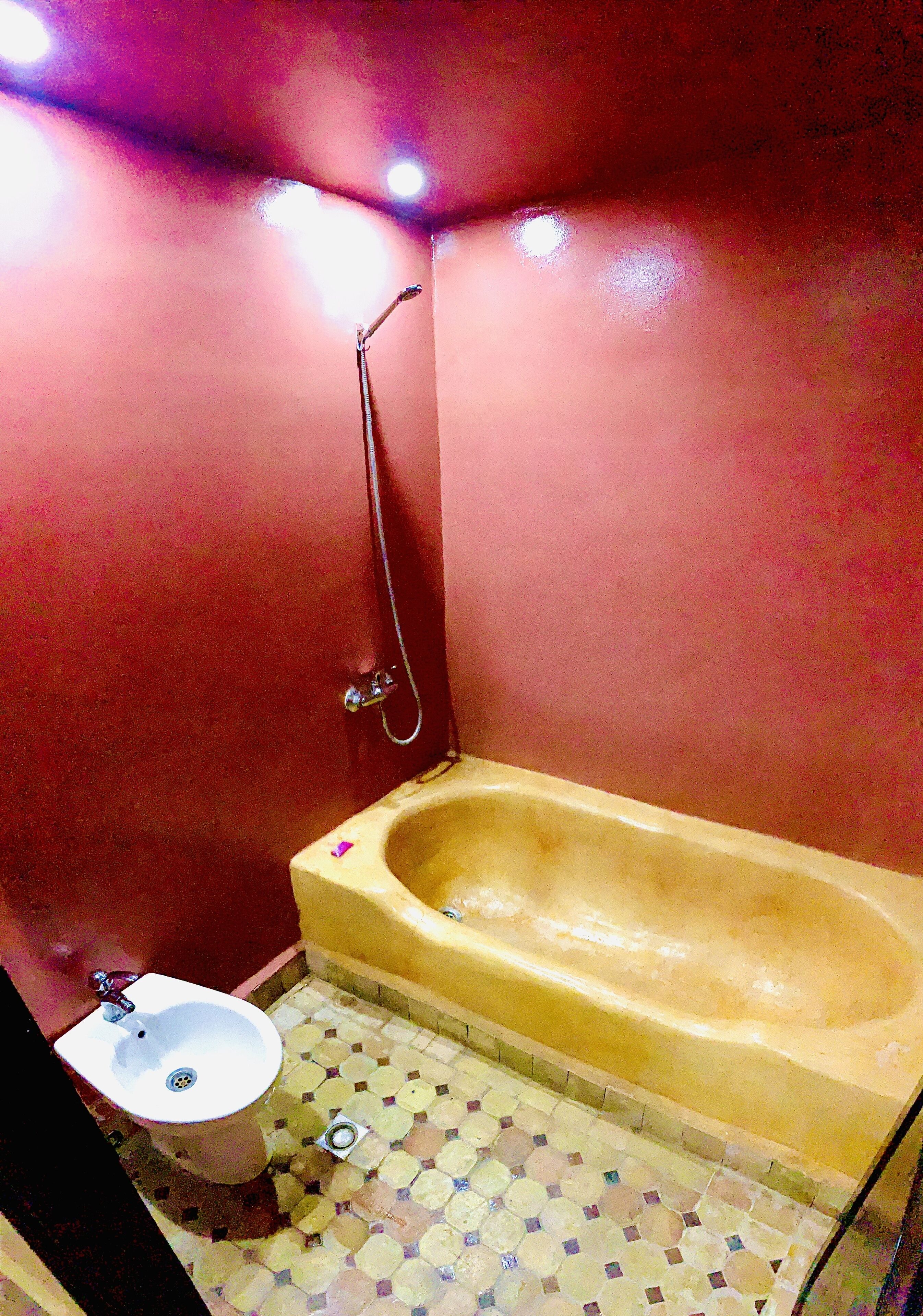 A bathroom with a bathtub, a sink, and a shower.