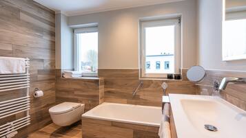 Family Suite Maisonette | Bathroom | Hair dryer, bathrobes, towels