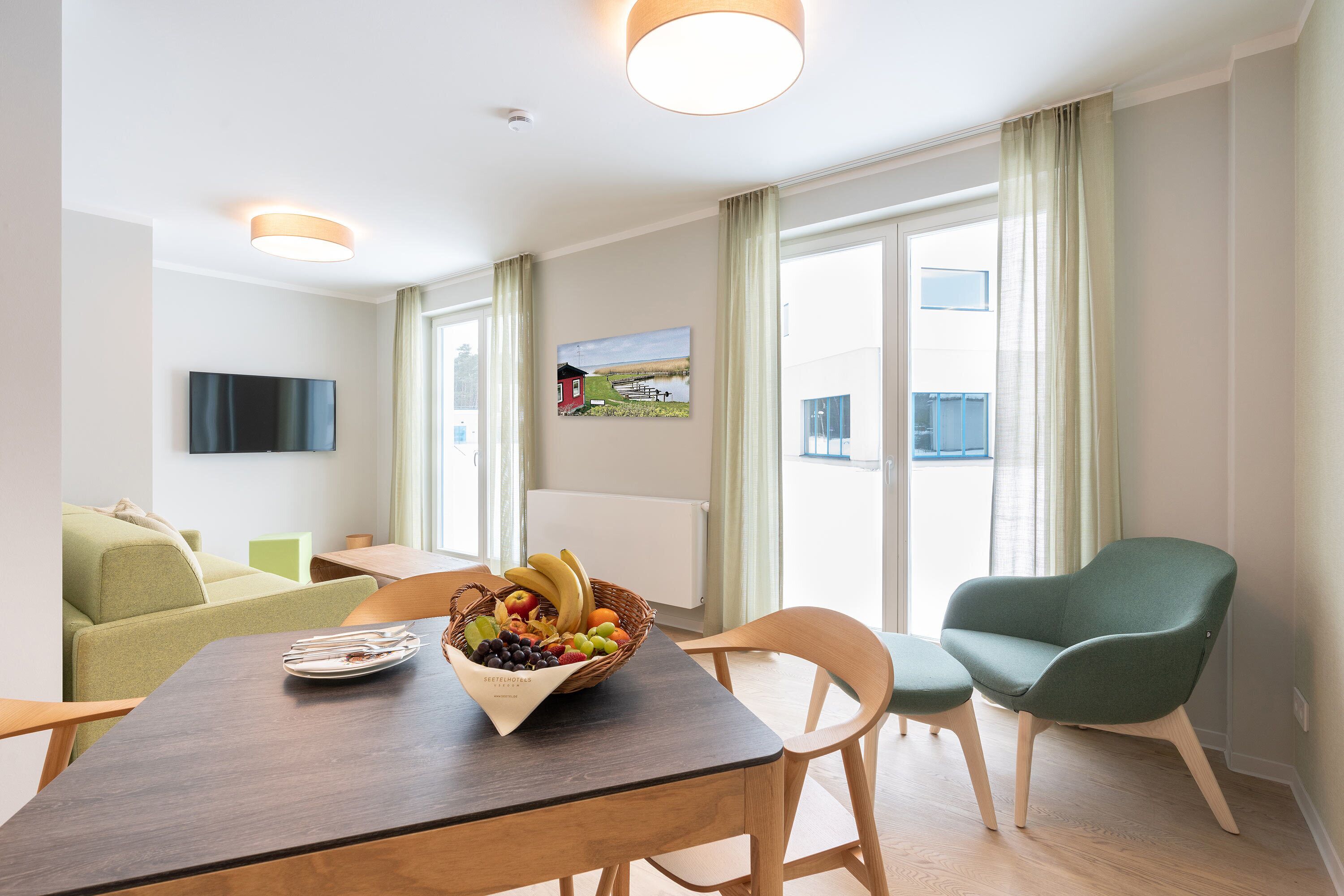 family suite maisonette | living area | flat-screen tv