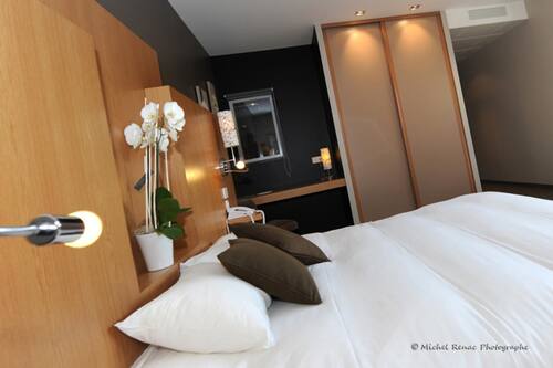 Premium bedding, desk, laptop workspace, soundproofing