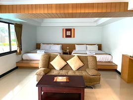 Family Room | Minibar, in-room safe, free WiFi, bed sheets