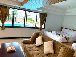 Family Room | Minibar, in-room safe, free WiFi, bed sheets