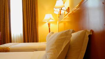 Deluxe Room with Pool View | Egyptian cotton sheets, premium bedding, minibar, in-room safe