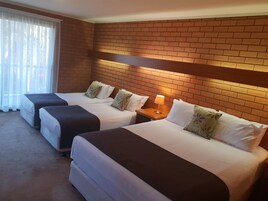 Premium bedding, pillowtop beds, laptop workspace, blackout drapes